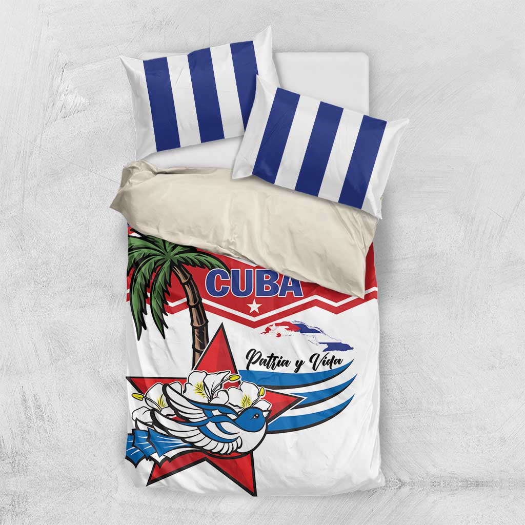 Folded Cuba-themed bedding set with striped pillows and white duvet with red and blue emblem