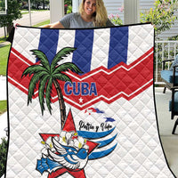 White Cuba-themed quilt with blue and red stripes, palm tree, bird, and 'Patria y Vida'.