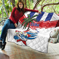 White Cuba quilt blanket with palm tree, bird graphic, and blue/red chevron stripes.