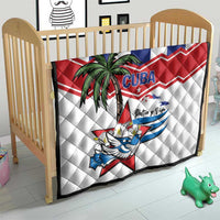 White quilt for baby crib with Cuba flag zigzag, palm tree, bird graphic, and 'Patria y Vida'.