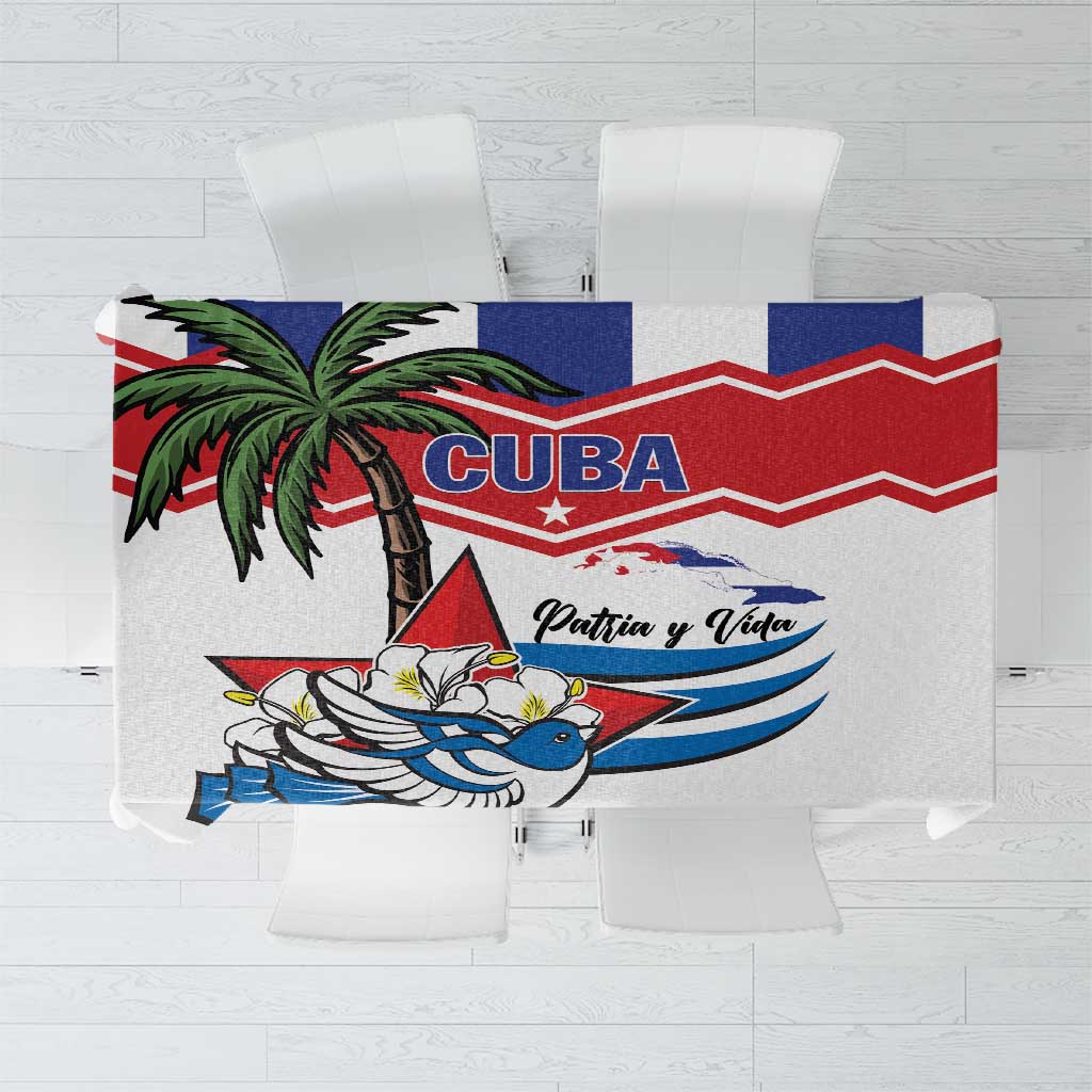 White square tablecloth with red and blue chevron border and Cuban bird graphic center