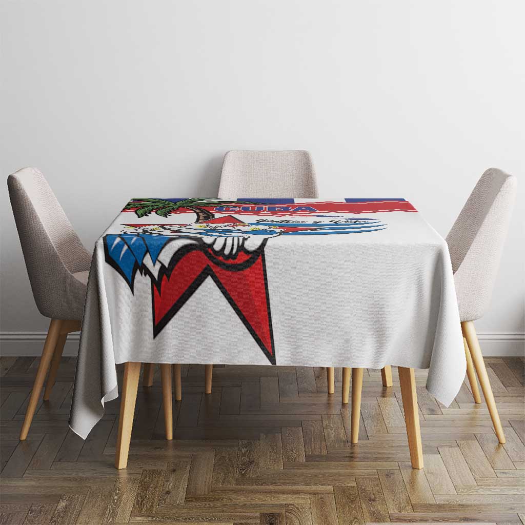 White tablecloth with colorful Cuban bird and red blue star motif centered