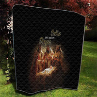 Black quilt throw with Feliz Dia de los Reyes lettering and Nativity illustration