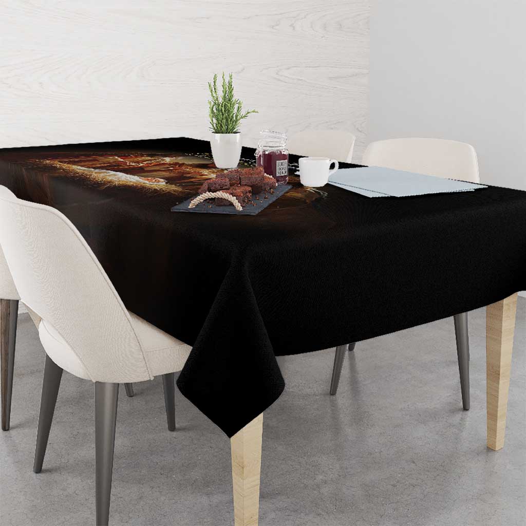 Black tablecloth covering dining table with folded corner and smooth drape