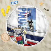 Round white beach blanket with blue-and-red graphic, “Dia de los Martires” text, fringe edge