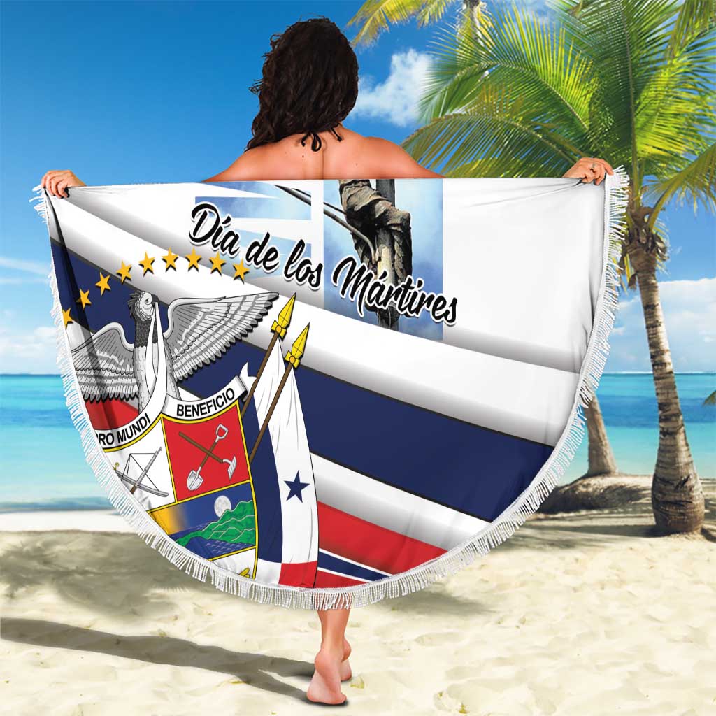 Round white beach blanket with “Dia de los Martires” and flag stripes, fringed border