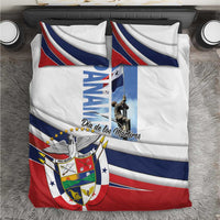 White bedding set with blue and red diagonal stripes and crest graphic, Dia de los Martires