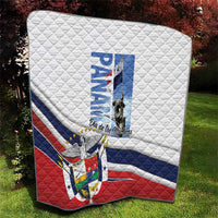 Panama Martyrs Day quilt on grass, diagonal blue and red flag with emblem