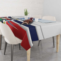 Printed tablecloth with diagonal red and blue bands and multicolor crest