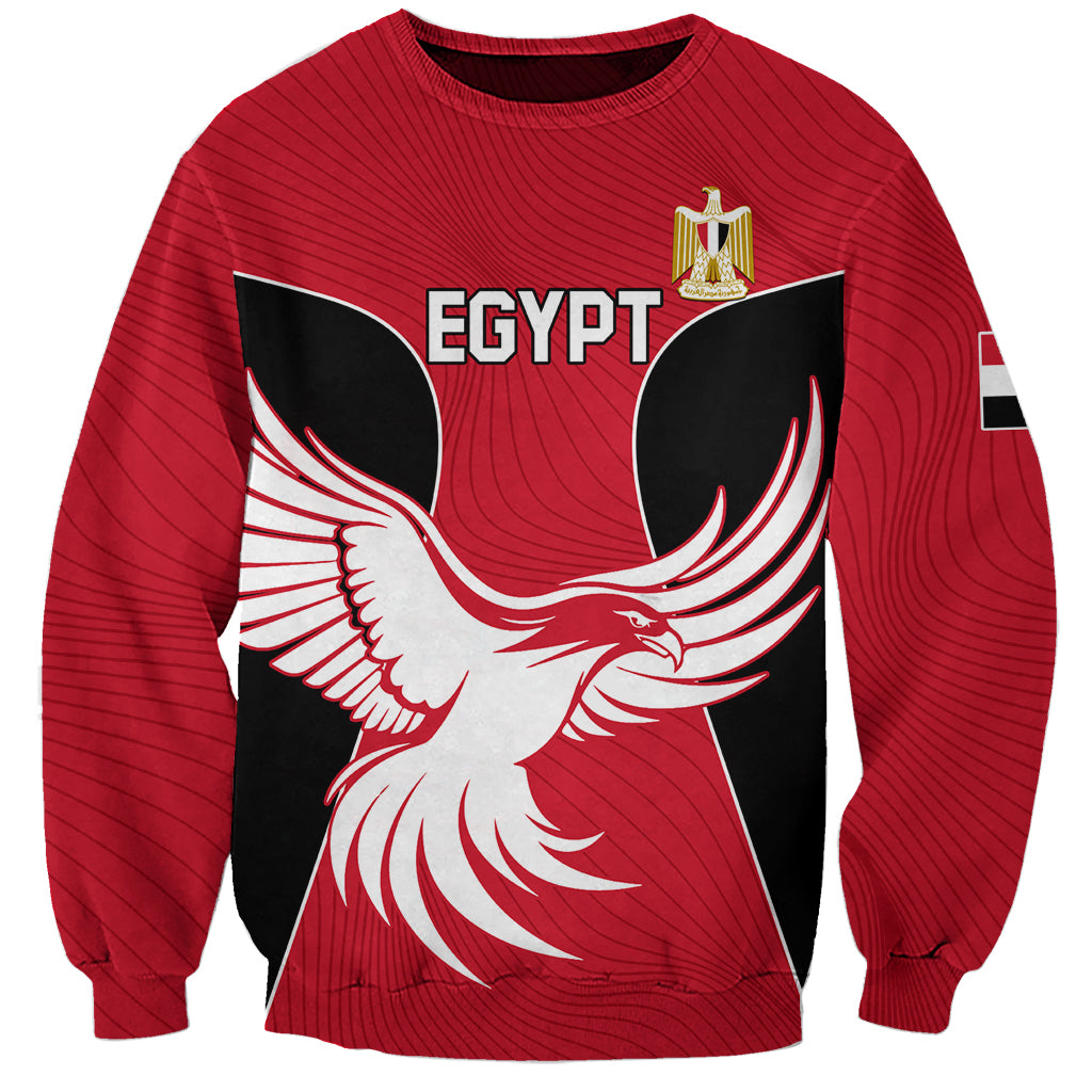 Red crewneck sweatshirt with EGYPT graphic and golden badge on chest, long sleeves