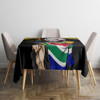 Black tablecloth featuring face portrait and South Africa flag pattern