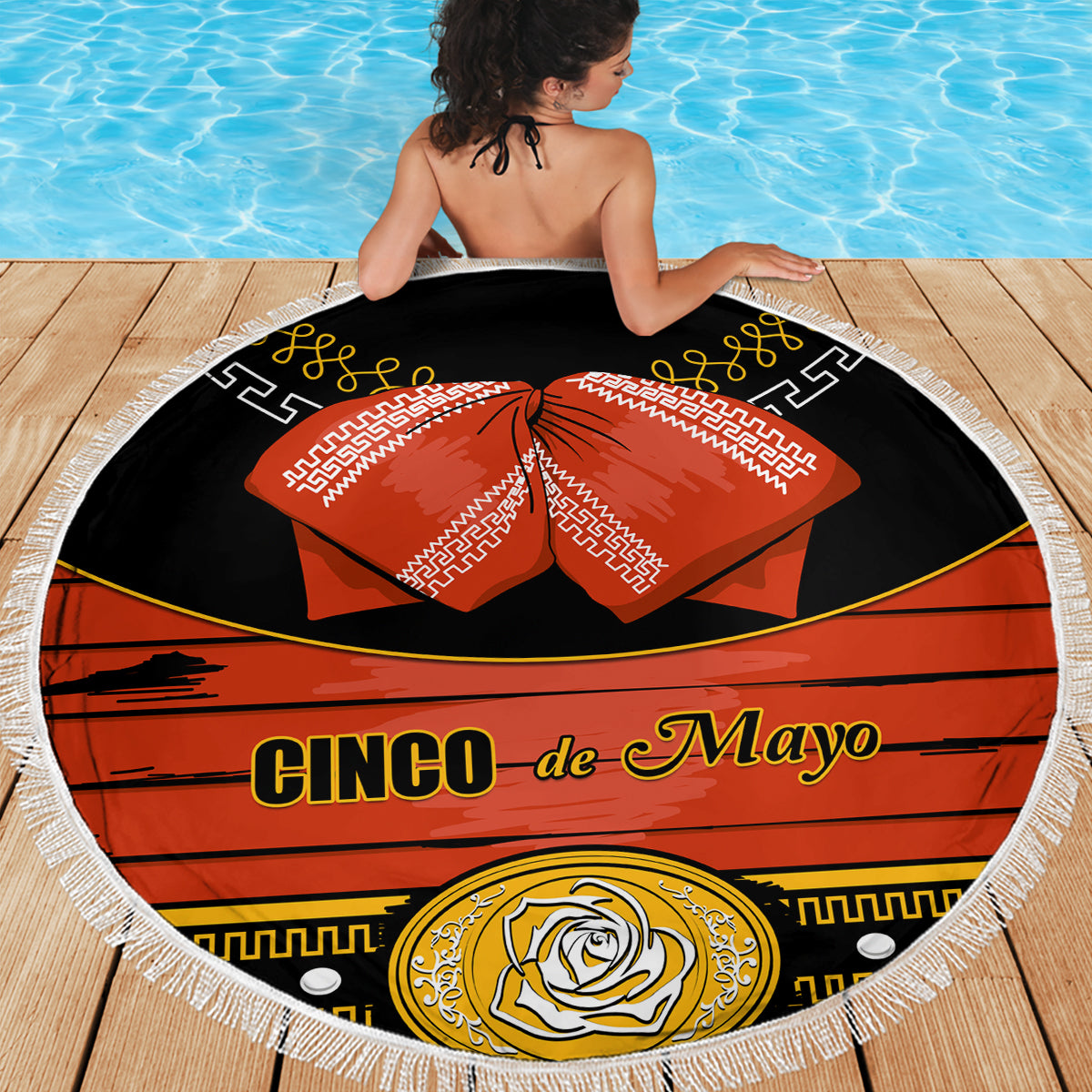 Fringed round beach blanket with black base and red Cinco de Mayo design