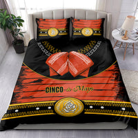 Cinco de Mayo bedding set on bed: black duvet with orange-red bands, gold emblems, 2 pillows