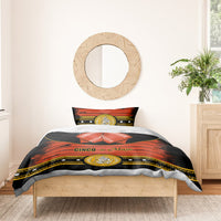 Cinco de Mayo bedding set: black duvet with orange-red bands, gold medallion, red bow detail
