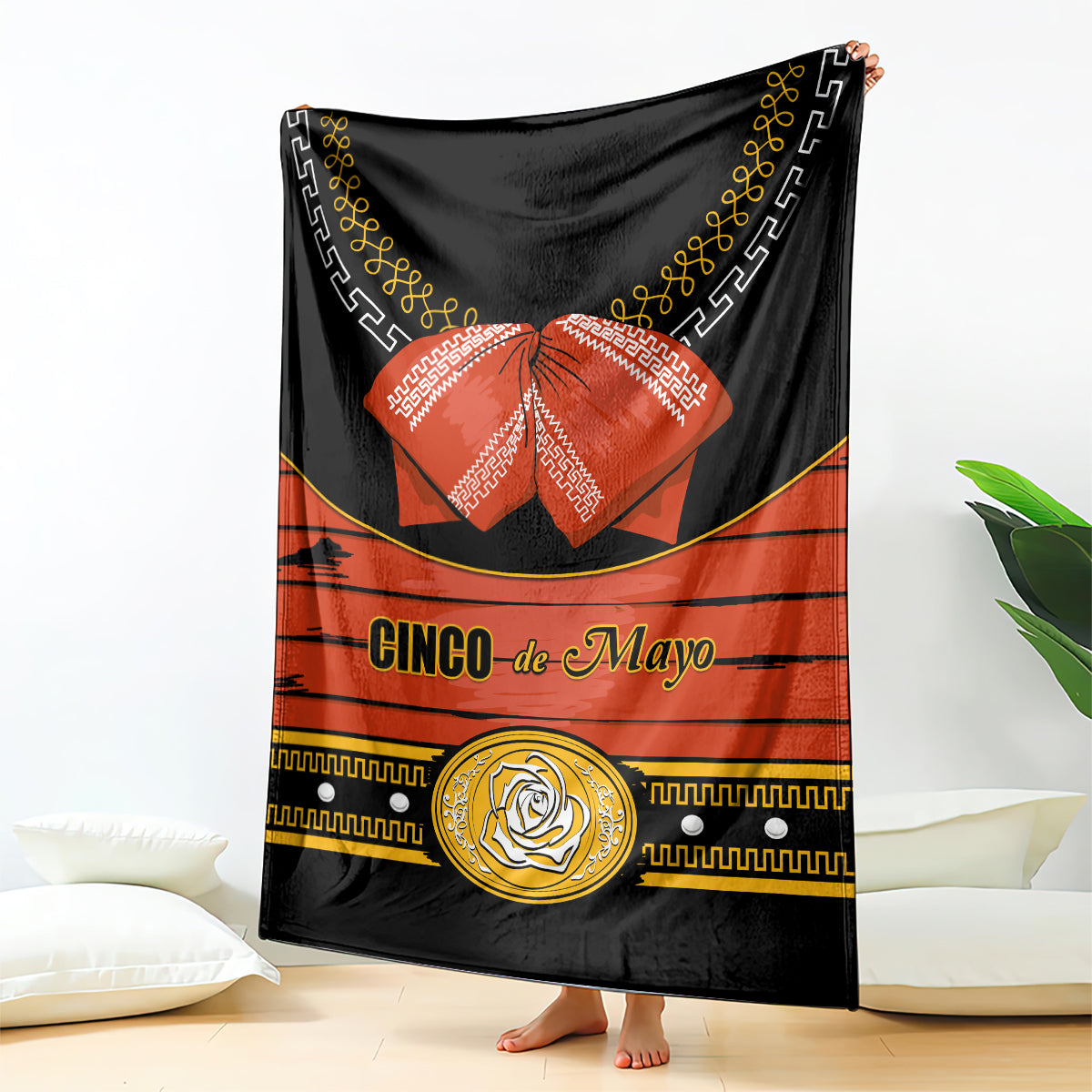 Black blanket with orange center stripe, gold trim and “Cinco de Mayo” text
