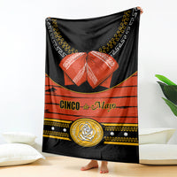 Black blanket with orange center stripe, gold trim and “Cinco de Mayo” text