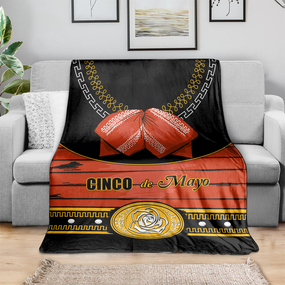 Black and orange Cinco de Mayo blanket with gold circular rose emblem