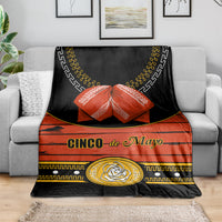 Black and orange Cinco de Mayo blanket with gold circular rose emblem