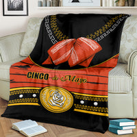 Black charro-style blanket with orange stripe, gold detailing and rose emblem