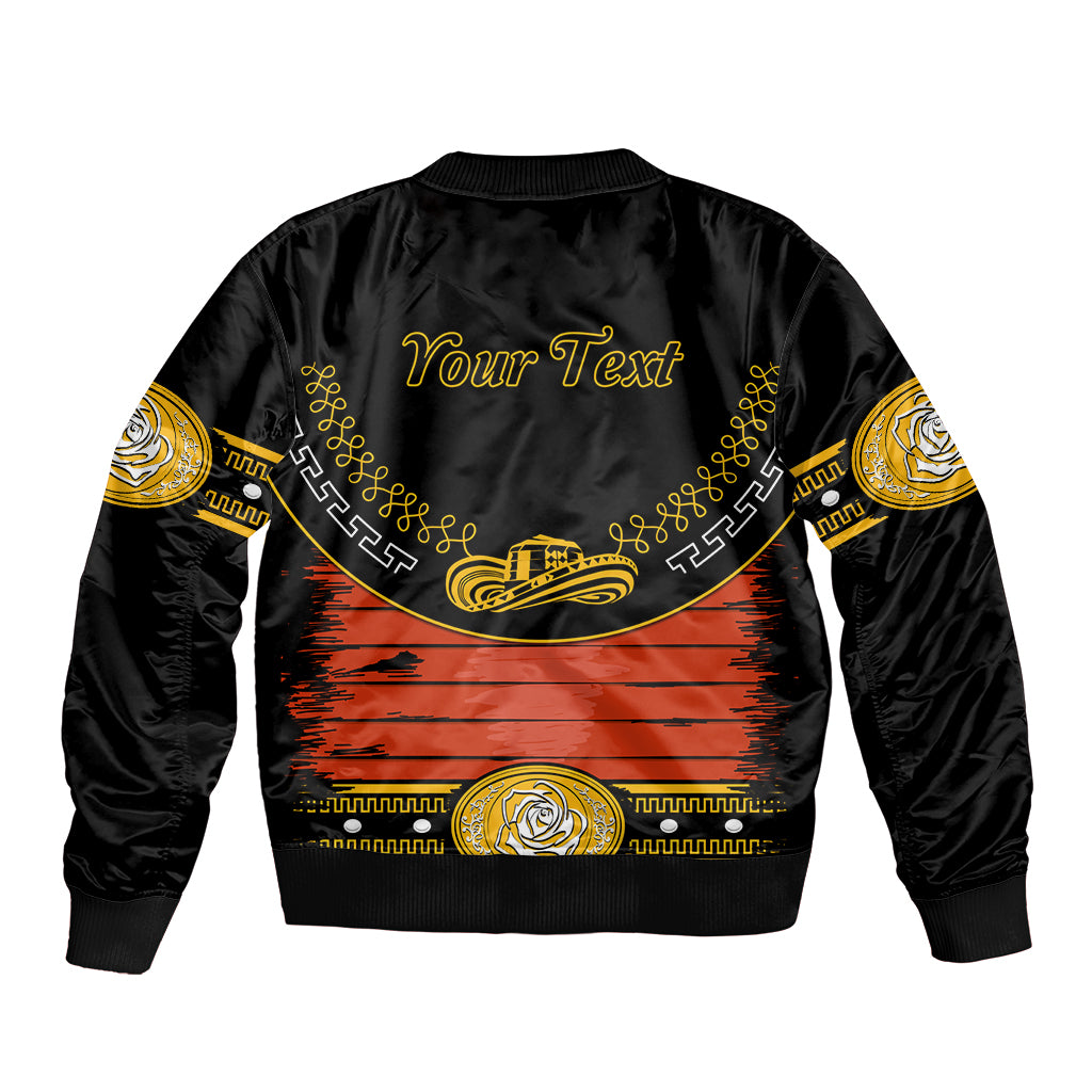 Black bomber jacket with orange graphic, gold trim, and “Your Text” print