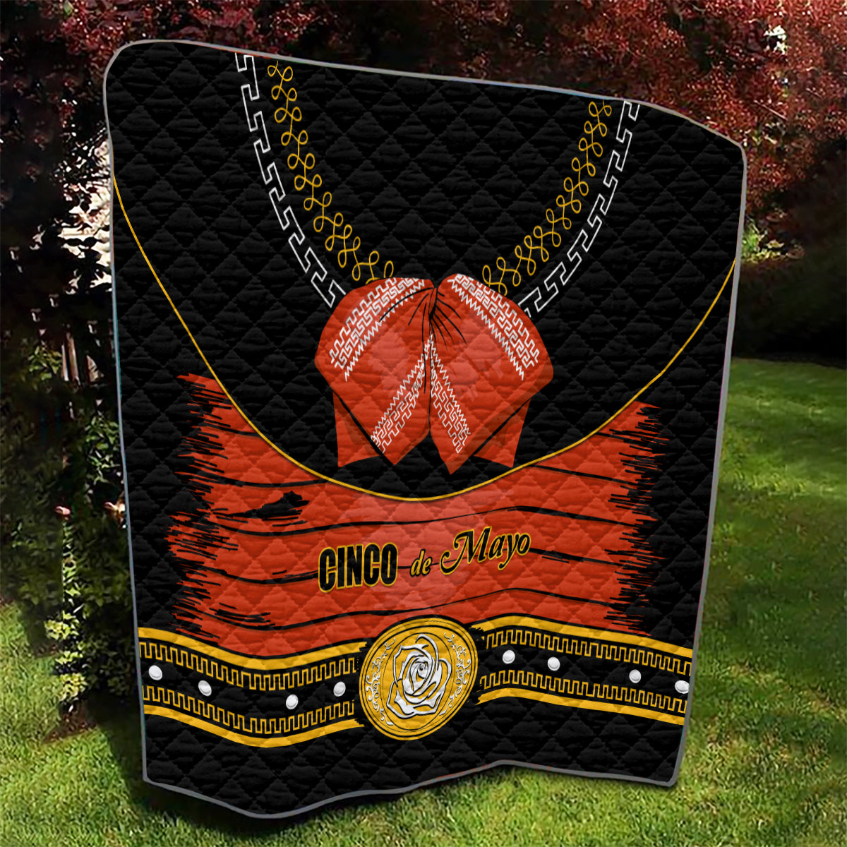 Black charro quilt with orange stripe, 'Cinco de Mayo' lettering, red bow, gold emblem