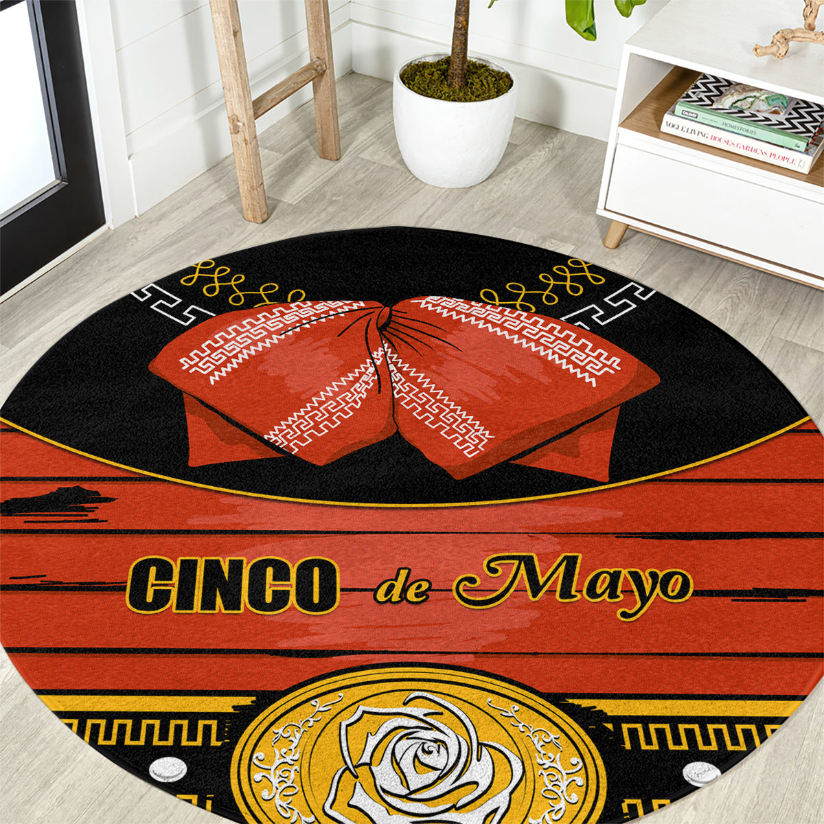 Black round carpet rug with 'Cinco de Mayo' text, orange bow, and gold rose detail