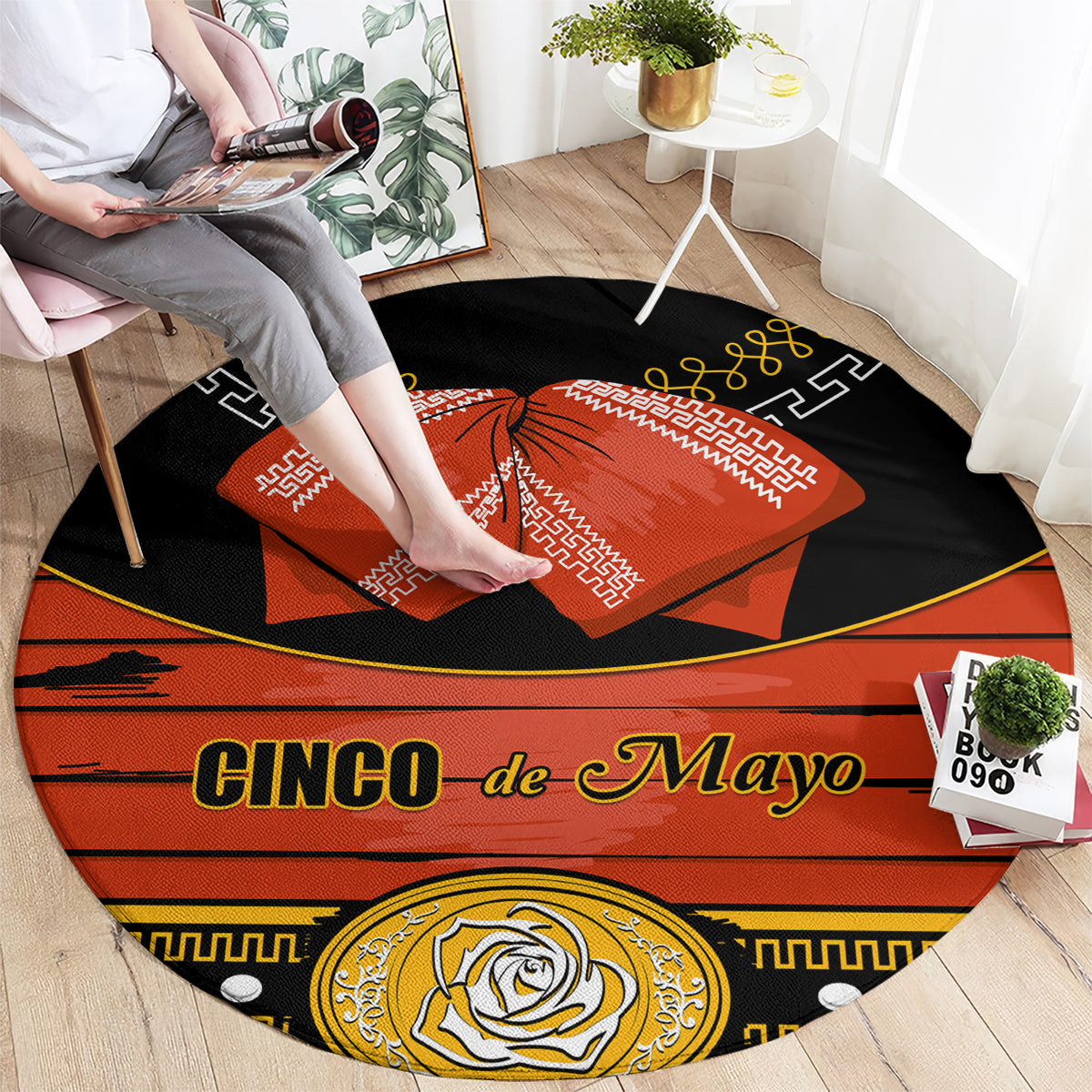 Black round carpet rug with 'Cinco de Mayo' text, orange bow, and decorative border