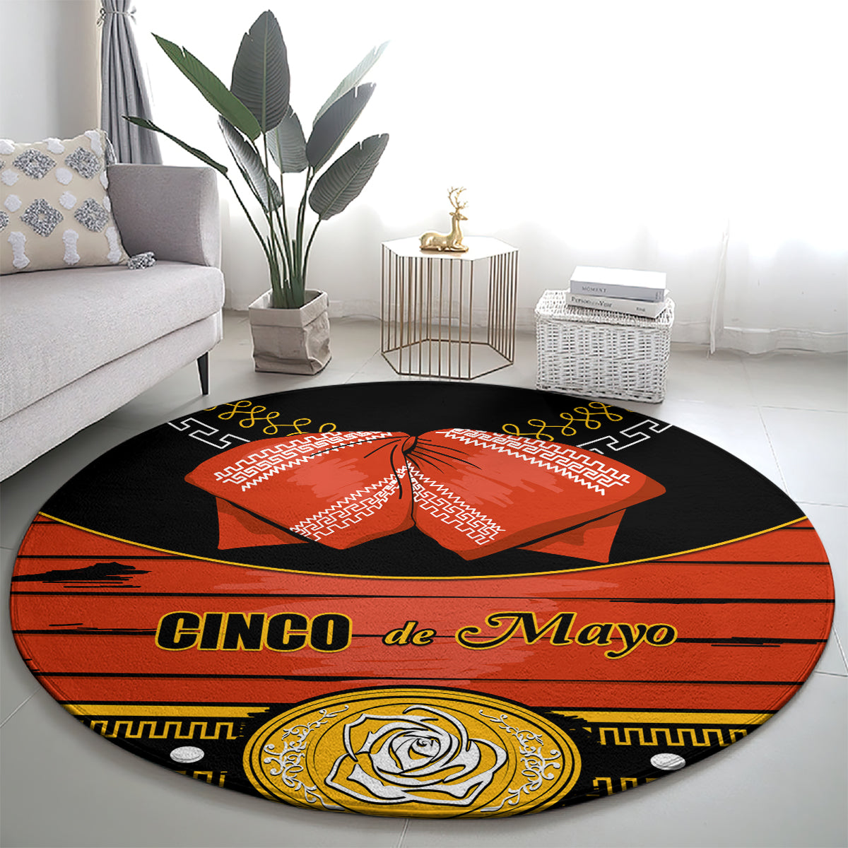 Black round carpet rug with 'Cinco de Mayo' lettering and orange bow in center
