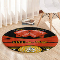 Black round carpet rug with 'Cinco de Mayo' banner, orange bow, and gold rose emblem