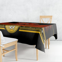 Black tablecloth with red striped band and gold trim draped over table