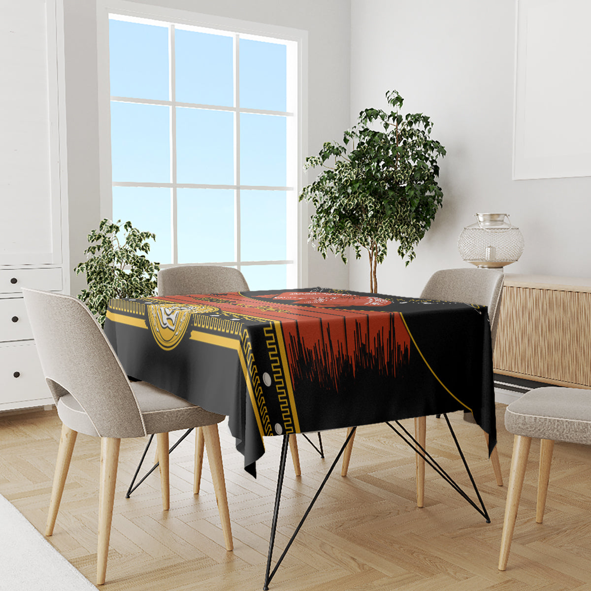 Black Cinco de Mayo tablecloth on dining table with gold border and red striped design