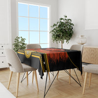 Black Cinco de Mayo tablecloth on dining table with gold border and red striped design