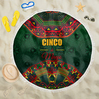 Green round beach blanket with white fringe edge and Cinco de Mayo folk pattern center