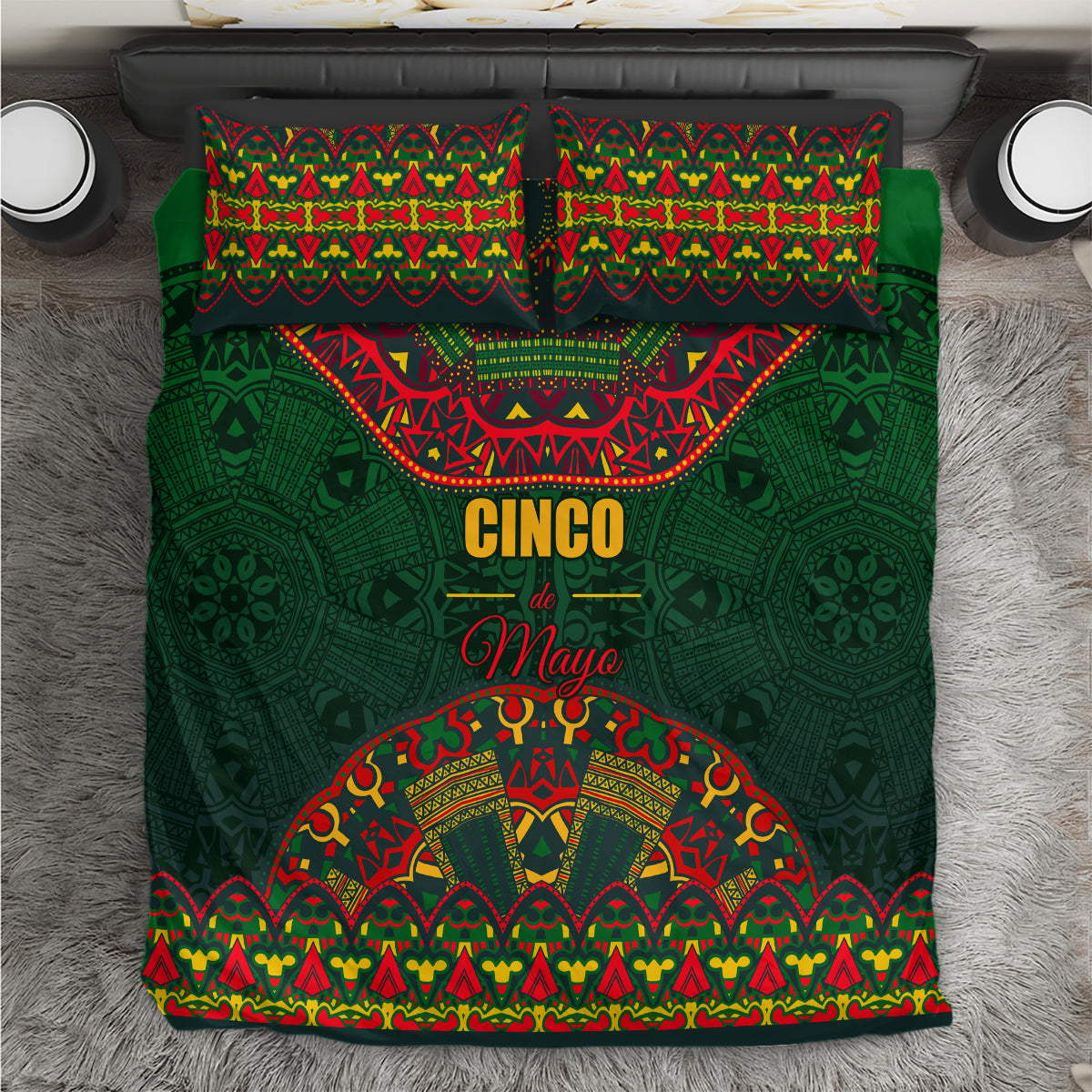 Green bedding set flat lay showing comforter with Cinco de Mayo text and folk motifs.