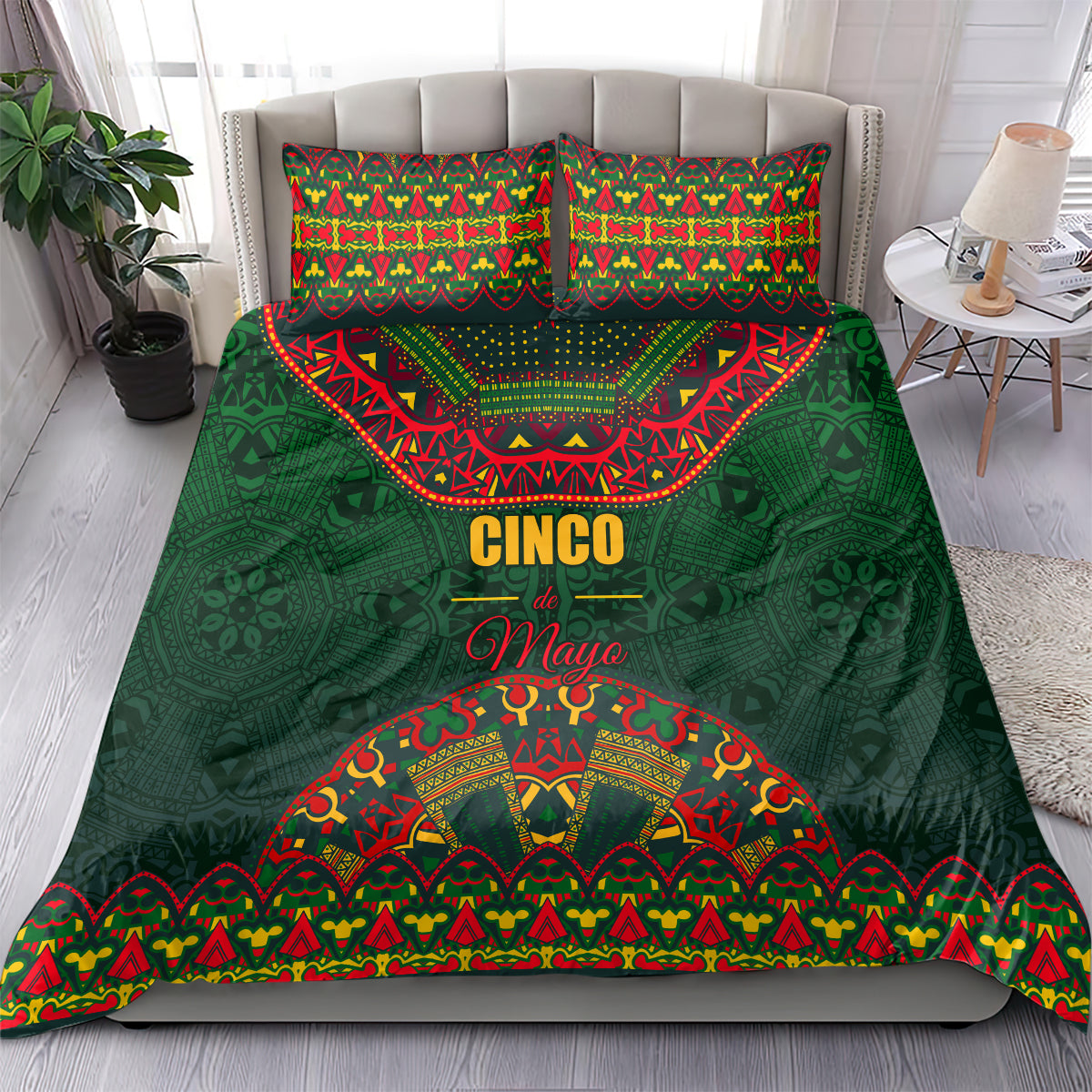 Green bedding set on bed with colorful folk pattern comforter and two matching pillowcases.