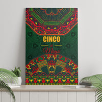 Green canvas wall art featuring “Cinco de Mayo” lettering and colorful folk motifs