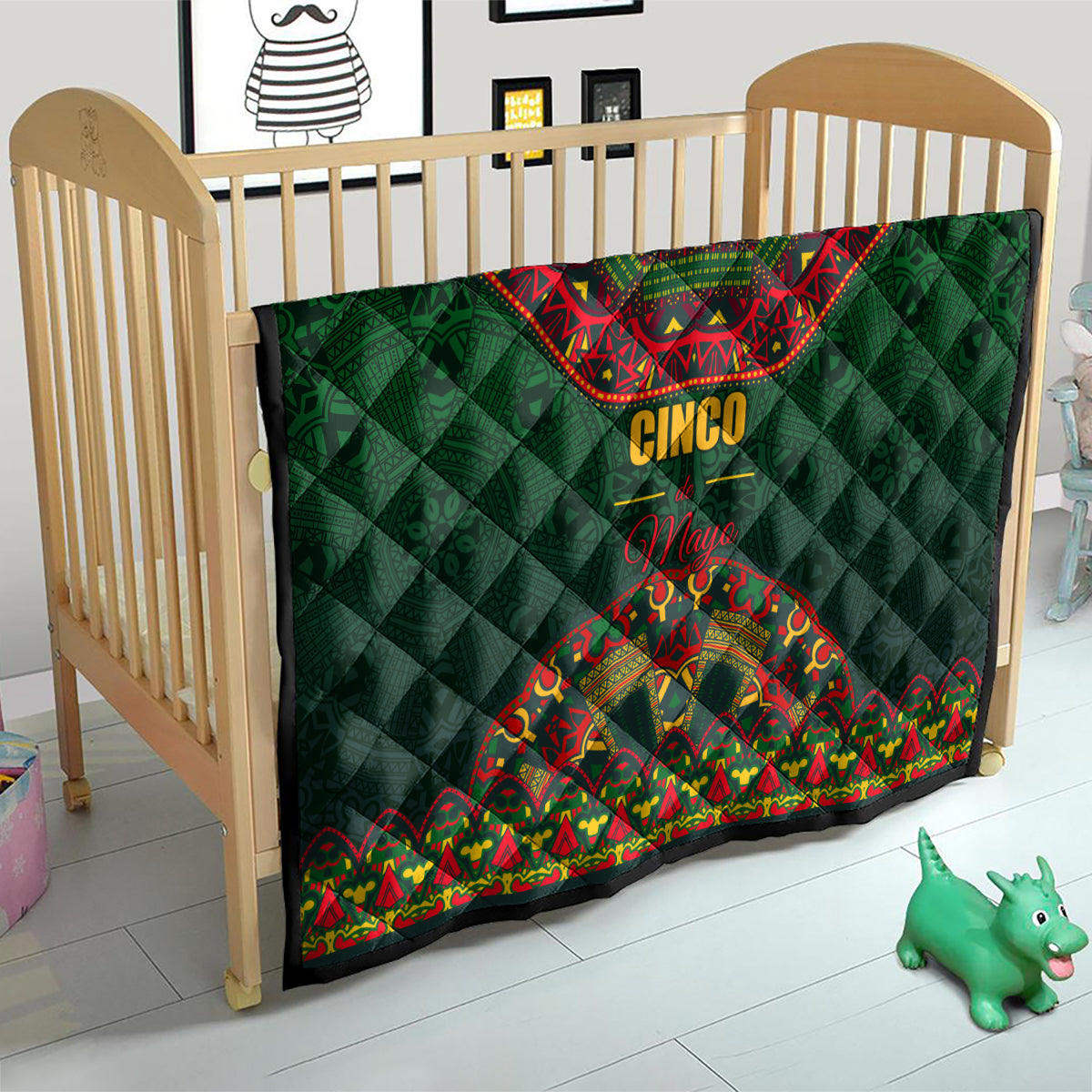 Green quilt blanket with red bandana print, 'Cinco' and 'Mayo' over diamond quilting
