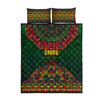 Green quilt bed set with Mexican folk pattern; “Cinco de Mayo” text; two matching pillows.