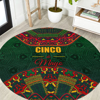 Green round carpet with Cinco de Mayo folk pattern and red yellow accents