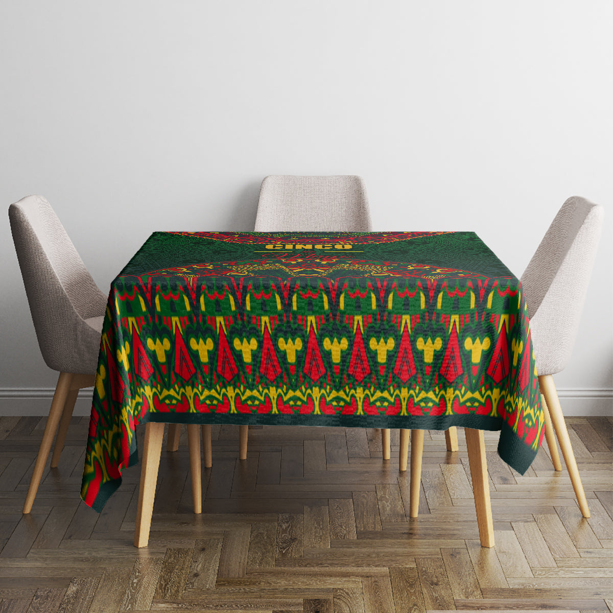 Green folk-pattern tablecloth with colorful geometric stripes across a dining table