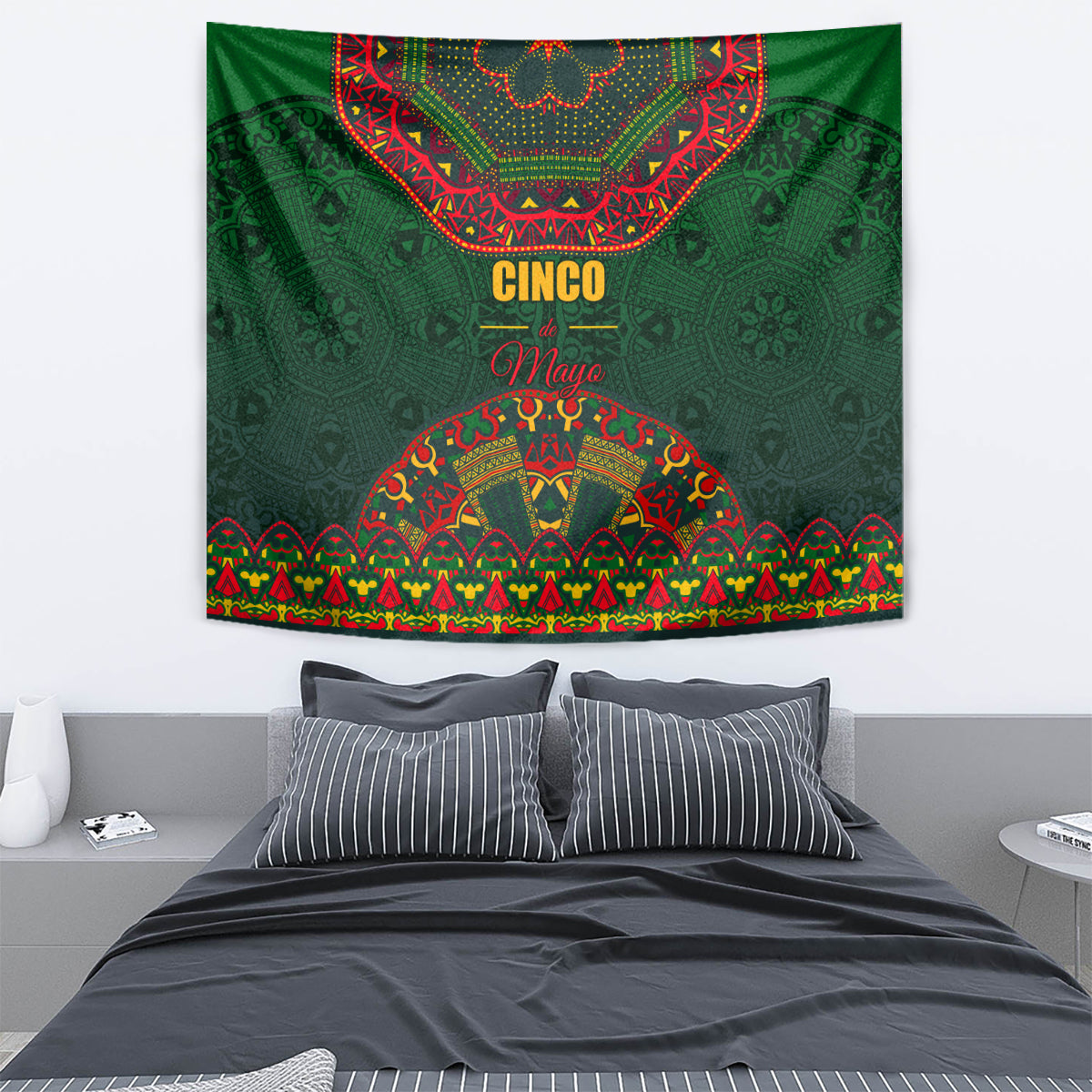 Green tapestry with Cinco May lettering and arched multicolor folk motifs