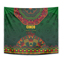 Green Mexican folk tapestry with Cinco May lettering and symmetrical arched motifs
