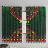 Green window curtain panels with red and yellow folk motif and decorative border hem