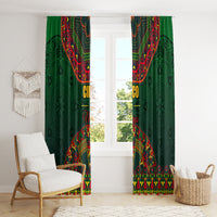 Green window curtains with colorful folk pattern, hanging on rod above window