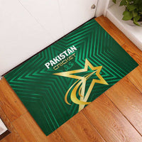 Green rubber doormat featuring Pakistan Cricket branding and gold star emblem