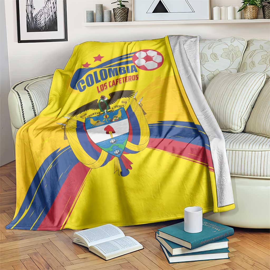 Yellow Colombia football blanket with crest, soccer ball graphic, and blue-red stripes