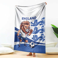 England football blanket draped on sofa with lion mascot, blue crests, and soccer ball
