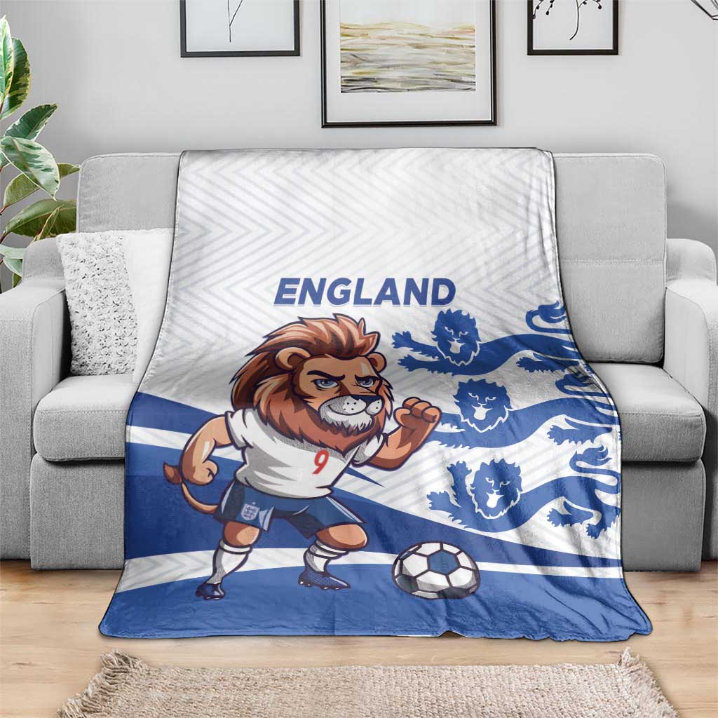 England football blanket on gray couch with lion mascot, soccer ball, and blue crests