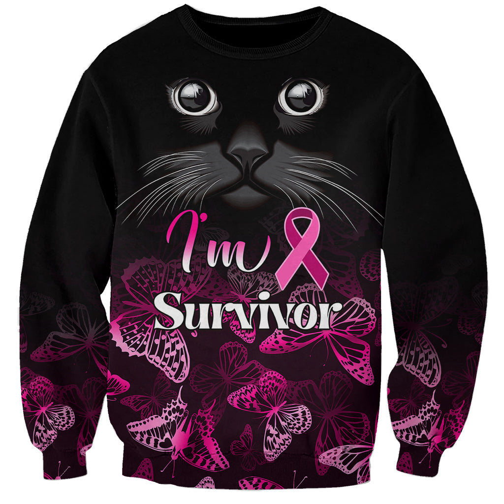 Black sweatshirt with pink ribbon cat graphic and 'I'm Survivor' slogan