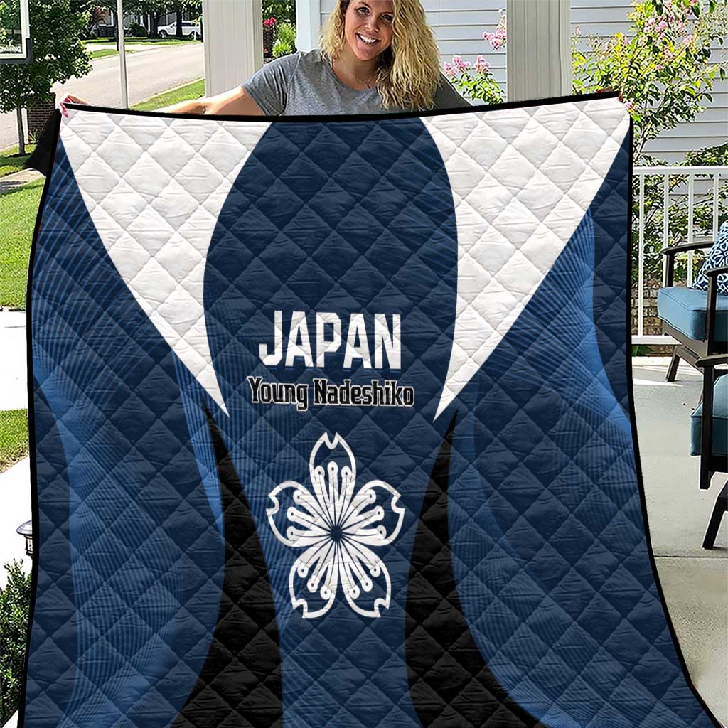 Football quilt with blue, black and white panels, Japan crest and “Young Nadeshiko” text